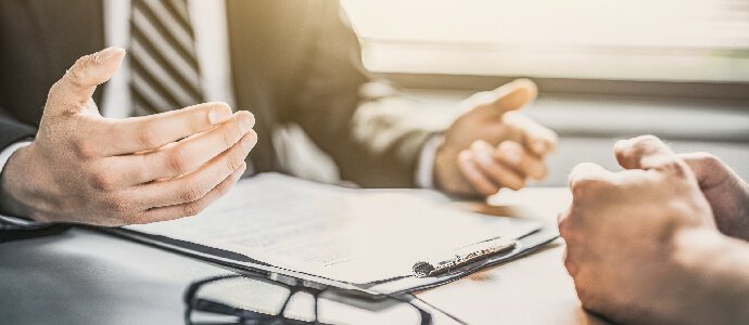 Client speaking with attorney